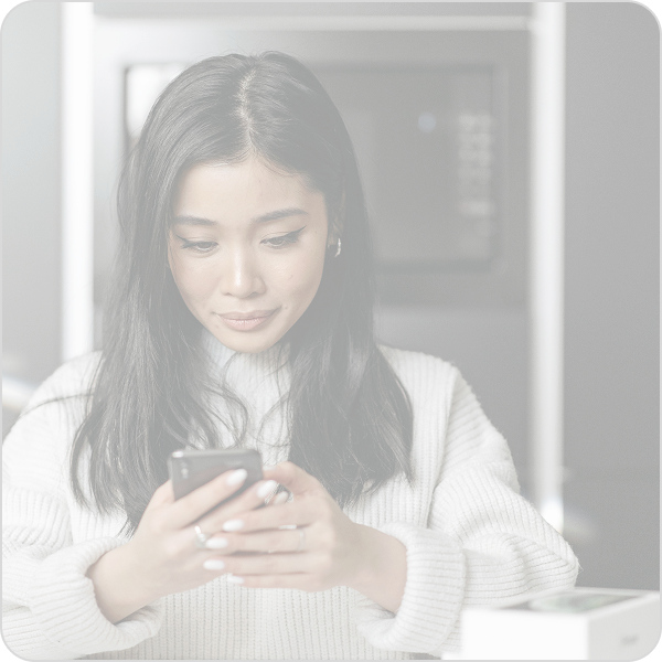 woman looking at mobile phone