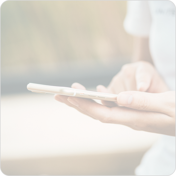 closeup hands holding and using mobile phone