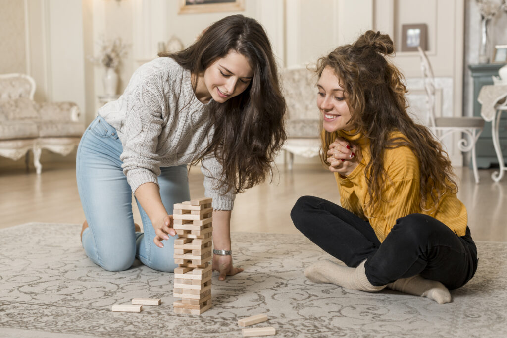 friends playing jenga ultimate sisterhood bucket list